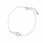 Srebrna bransoletka typu celebrytka z serduszkiem i znakiem nieskończoności. Biżuteria wysadzana cyrkoniami.