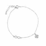 Srebrna bransoletka typu celebrytka z koniczynką i znakiem nieskończoności.