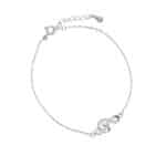 Srebrna bransoletka z motywem klucza wiolinowego. Bransoletka zdobiona cyrkoniami.